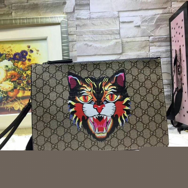 G*u*i clutch bags